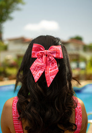 Vibrant and playful, this statement bow brings color to every outfit. Featuring bold prints and soft fabric, it’s the perfect pop for summer. Ships fast.