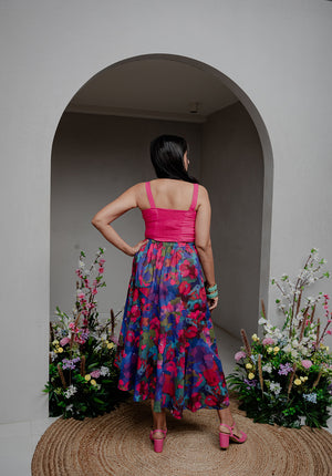 Showcasing the flowy silhouette and gathered hem of the printed skirt.