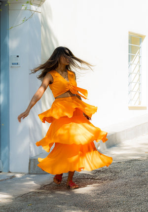Flowy ruffle skirt and notch collar top designed for effortless elegance and comfort, ideal for tropical vacations.