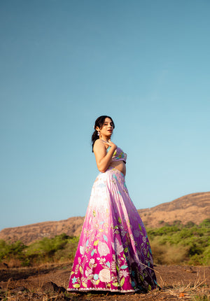 Side pose emphasizing the intricate details of the lehenga set.
