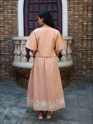 Back view of fawn coord set with relaxed fit and embroidered border
