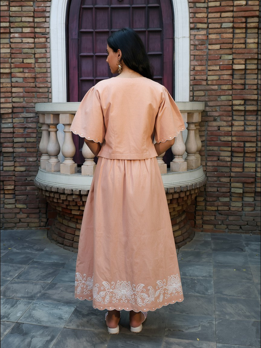 Back view of fawn coord set with relaxed fit and embroidered border