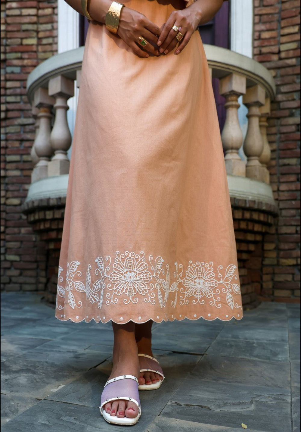 Close-up of embroidered hem detailing on fawn coord set pants
