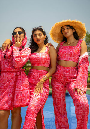 Three models in outfits with matching prints but different silhouettes — a versatile design series.