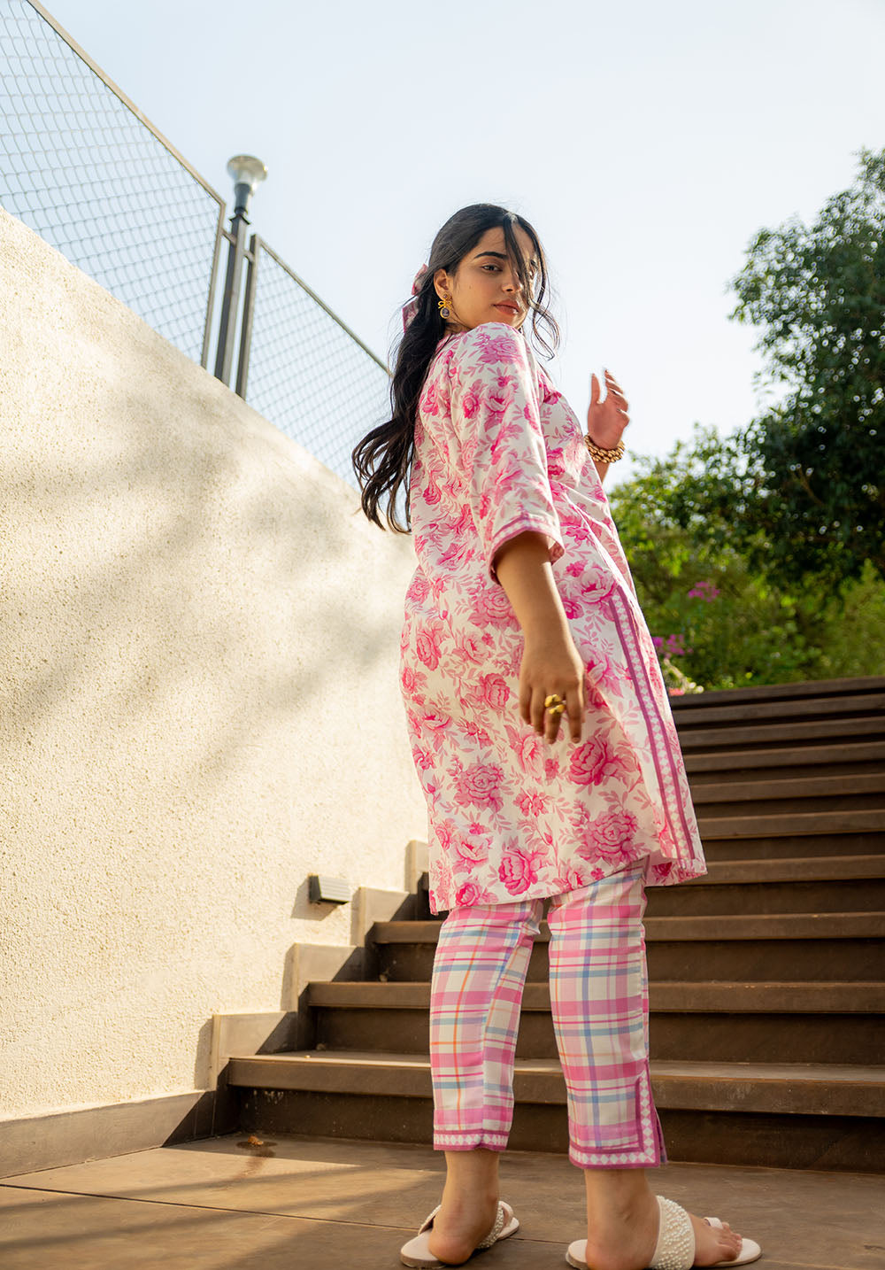 Back view of kurta set featuring 3/4th sleeves and full-length kurta with printed detail.