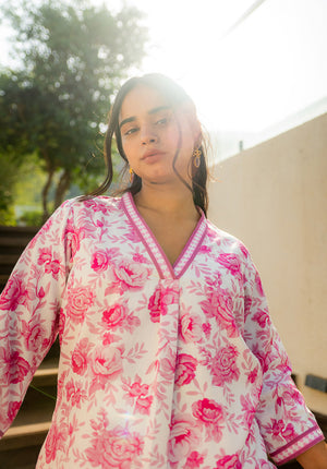 Artistic close-up with lighting focus on kurta’s neckline and print pattern.