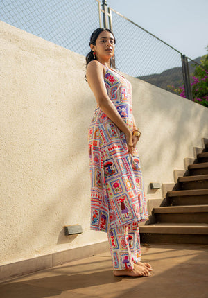 Side pose of model highlighting the side cut/slit detail of the printed kurta set.