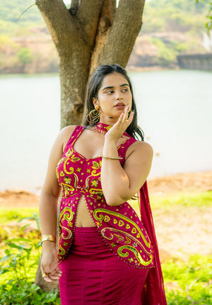 Lehenga blouse with long length and central cut detailing, paired with coordinated ethnic skirt and dupatta.
