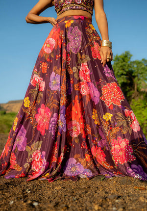 Lehenga skirt with floral print and intricate embellishments, styled for ethnic elegance.