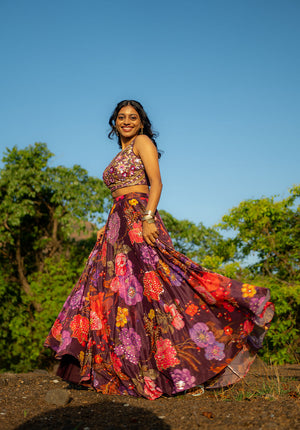 Model showcasing matching lehenga blouse and skirt with golden bangles for an elegant festive look.