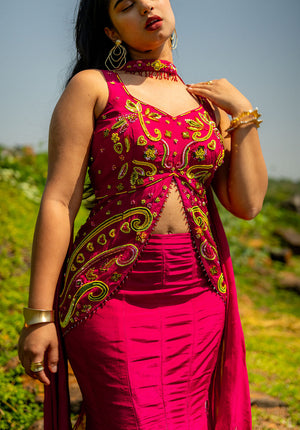 Sleeveless lehenga blouse with a curved V-neckline, offering a graceful and chic festive appearance.