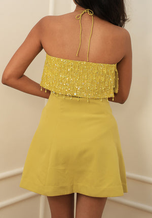 Back view of the Limoncello Sequin Halter Mini Dress with halter tie-back and A-line skirt.
