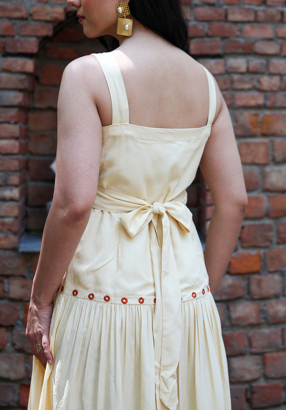 Back view of Marigold midi dress with tie-back waist detail