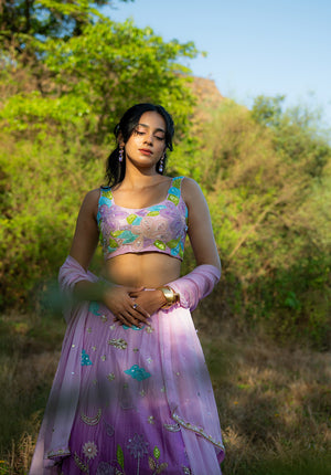 Model in lehenga set with matching dupatta — graceful festive ensemble.