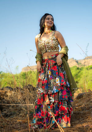 Model in printed skirt and fully embellished blouse with a contrasting dupatta.