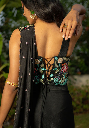 Back view of blouse with tie detailing, paired with matching draped saree in fusion set.