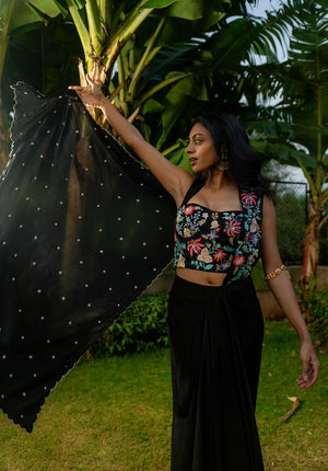 Model wearing saree fusion set with blouse and draped pallu, standing gracefully to highlight the silhouette.