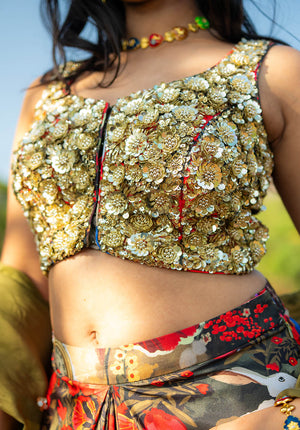 Close-up of sleeveless blouse with V-neckline, styled for an elegant look.