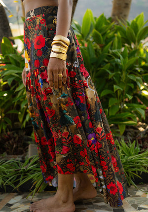 Focus on a multicolored floral long skirt with flowing silhouette