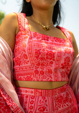 Close-up of printed top featuring square neckline and sleeveless design