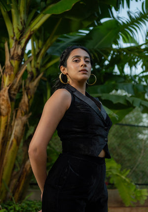 Side view of the model highlighting the structure of the black waistcoat