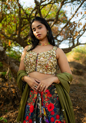 Focus on printed and worked blouse paired with a matching skirt.