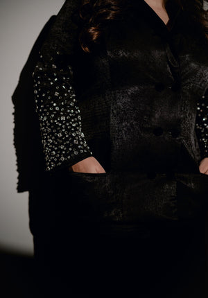 Close-up shot of crystal-embroidered sleeves of the Blackout Blazer, highlighting intricate details.