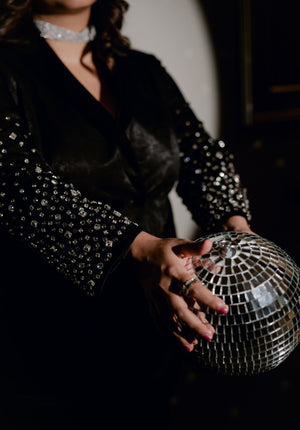 Close-up shot of crystal-embroidered sleeves of the Blackout Blazer, highlighting intricate details.