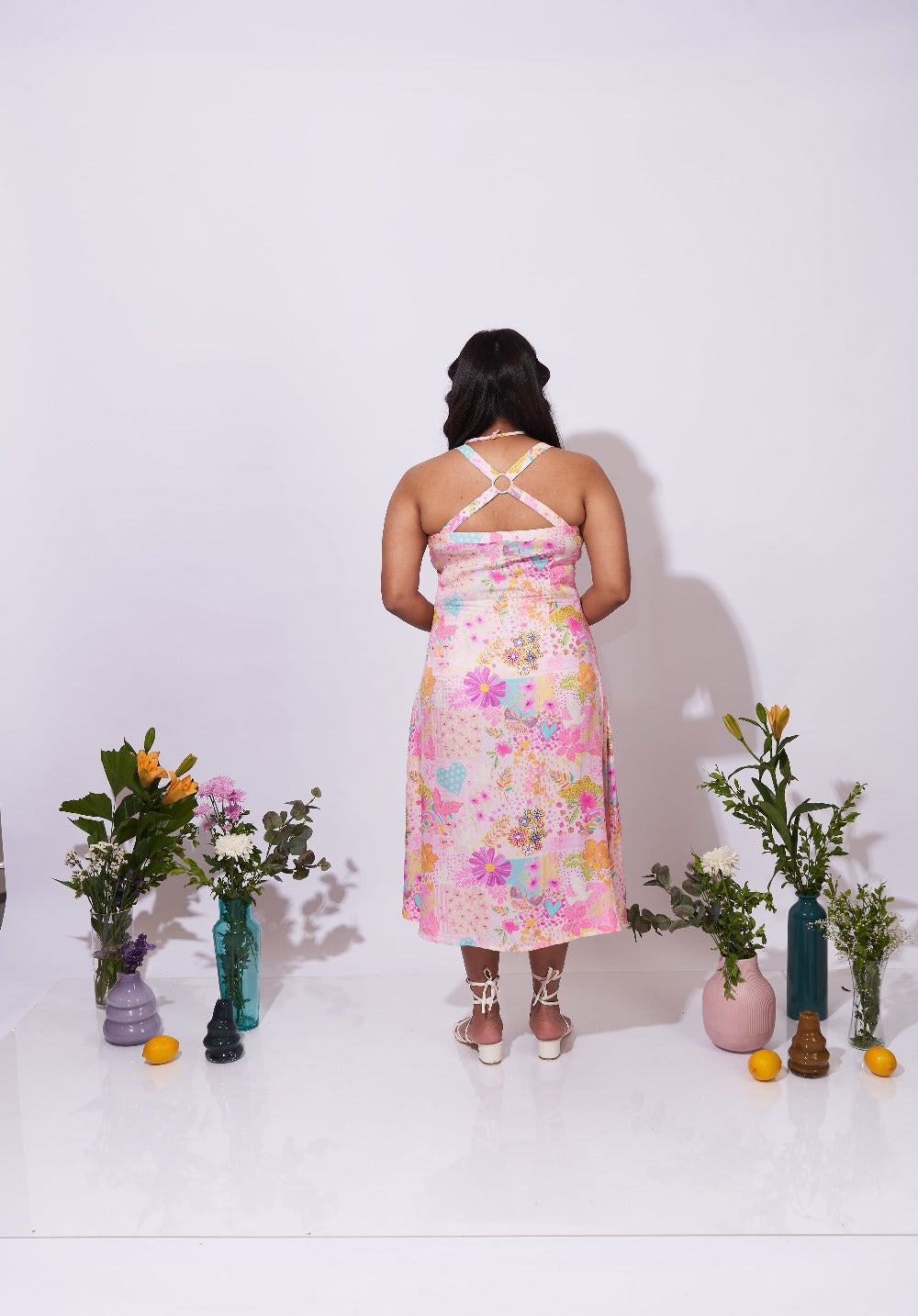 Back view of the Allora Dress – Crisscross strap detailing with metal ring