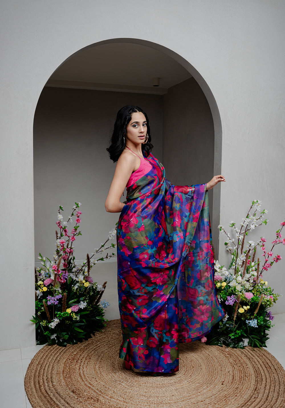 Side view of Back from Vacay Saree, highlighting the delicate appliqué work and soft flow of the Kota Silk fabric.