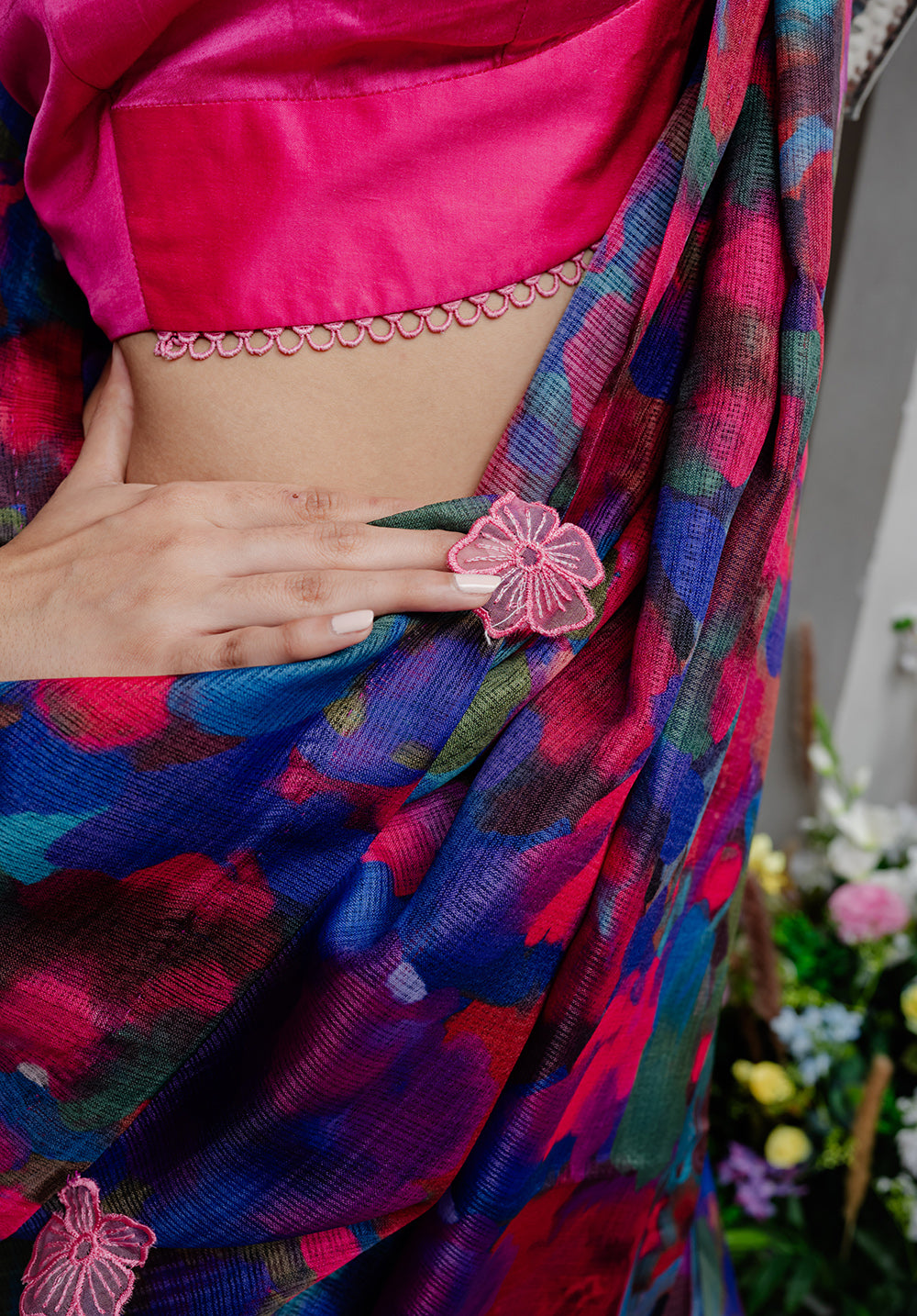 Close-up of the digitally printed pallu with hand-stitched appliqué flowers, adding charm to the Back from Vacay Saree.