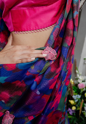 Close-up of the digitally printed pallu with hand-stitched appliqué flowers, adding charm to the Back from Vacay Saree.