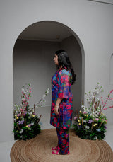 A side-angle showcasing the elegant bell sleeves and flattering silhouette.