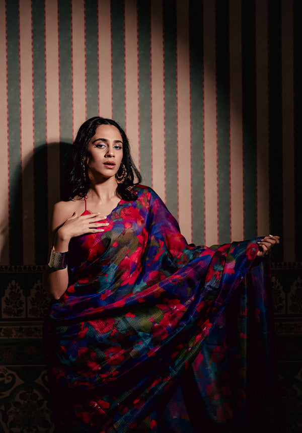 Model wearing Back from Vacay Saree, a digitally printed Kota Silk saree with handcrafted appliqué flowers, styled elegantly for a festive look.