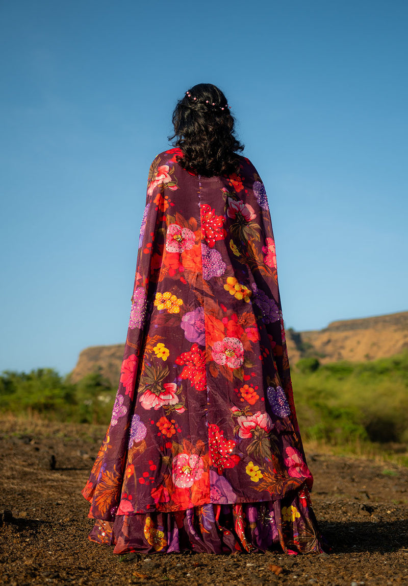 Back side of lehenga showing fully floral printed matching dupatta styled with traditional elegance.
