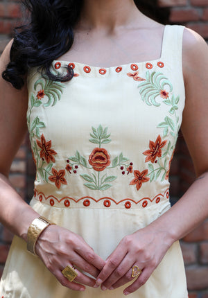 Close-up of floral embroidery detail on Marigold dress bodice