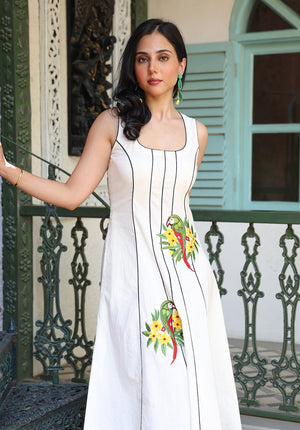Angled front view of Parasio embroidered midi dress with tropical parrot detailing