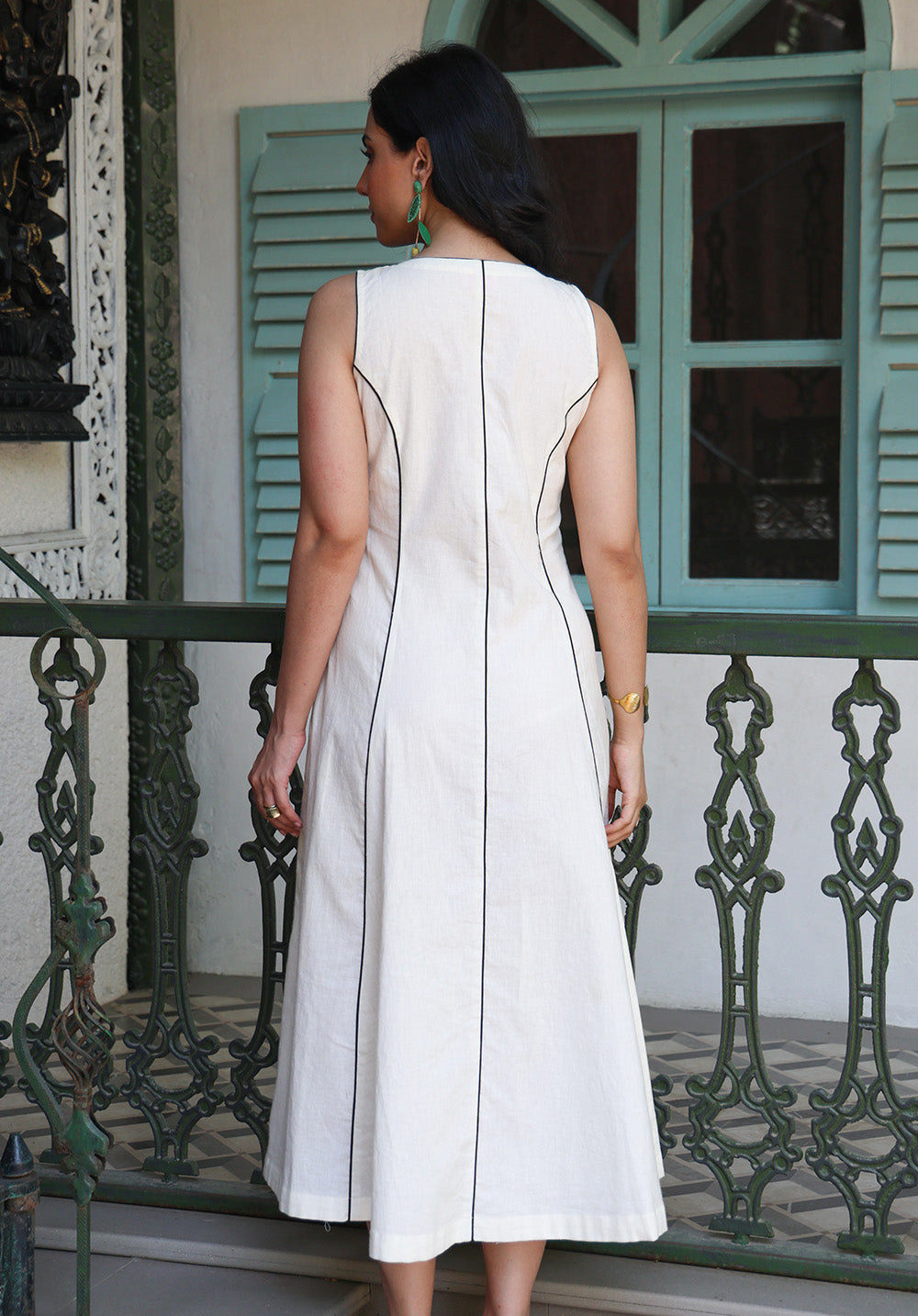 Back view of ivory Parasio midi dress with structured panel detailing