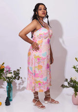 Model wearing the Allora Dress – A-line floral dress with elegant modern details